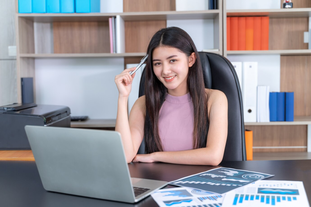 Woman optimizing bookkeeping through accounting integration  with ecommerce erp system.