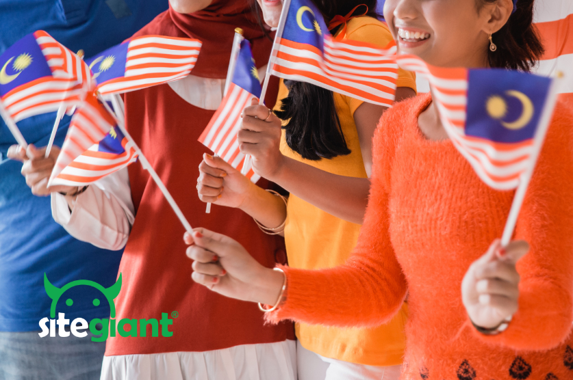people are waving Malaysia flag